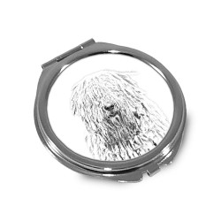 Komodor - Taschenspiegel mit einem Bild eines Hundes.