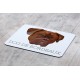 A mouse pad with the image of a dog.