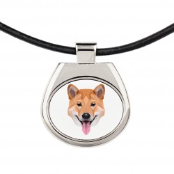 Un collar con un perro Shiba Inu. Una nueva colección con el perro geométrico