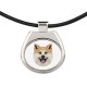 Un collar con un perro Akita Inu. Una nueva colección con el perro geométrico
