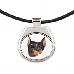 Un collar con un perro Pinscher alemán. Una nueva colección con el perro geométrico
