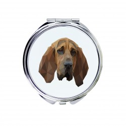 Un espejo de bolsillo con un perro Perro de San Huberto. Una nueva colección con el perro geométrico