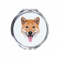Un espejo de bolsillo con un perro Shiba Inu. Una nueva colección con el perro geométrico