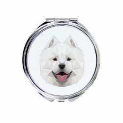 Un espejo de bolsillo con un perro Samoyedo. Una nueva colección con el perro geométrico