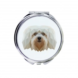 Un espejo de bolsillo con un perro Bichón habanero. Una nueva colección con el perro geométrico