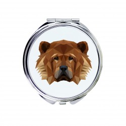 Un miroir de poche avec un chien Chow chow. Une nouvelle collection avec le chien géométrique
