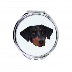Un espejo de bolsillo con un perro Dobermann uncropped. Una nueva colección con el perro geométrico