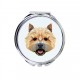 Uno specchio tascabile con un cane Norwich Terrier. Una nuova collezione con il cane geometrico