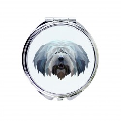 Un espejo de bolsillo con un perro Pastor polaco de Valée. Una nueva colección con el perro geométrico