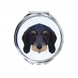 Un espejo de bolsillo con un perro Perro salchicha wirehaired. Una nueva colección con el perro geométrico