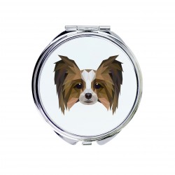 Uno specchio tascabile con un cane Epagneul. Una nuova collezione con il cane geometrico