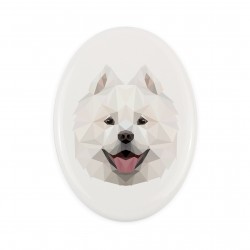A ceramic tombstone plaque with a Samoyed dog. Geometric dog