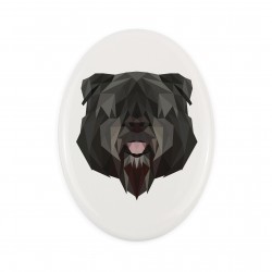 Una placa de cerámica con un perro Boyero de Flandes. Perro geométrico.