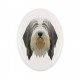 A ceramic tombstone plaque with a Bearded Collie dog. Geometric dog